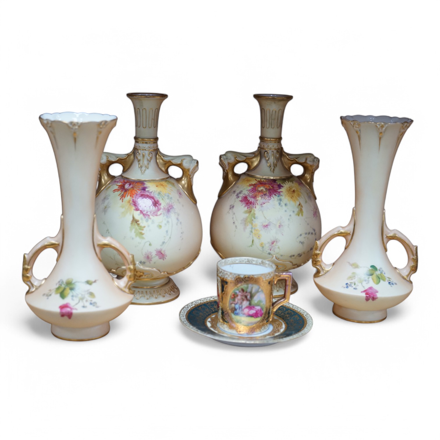 Two pairs of Royal Worcester blush ivory vases, model numbers 2332 and 1626 and Vienna type coffee can with saucer, tallest 22cm. Condition - good